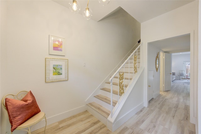 stairway with wood-type flooring