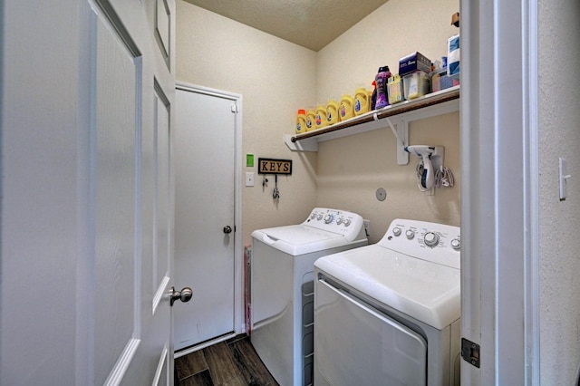 clothes washing area with separate washer and dryer