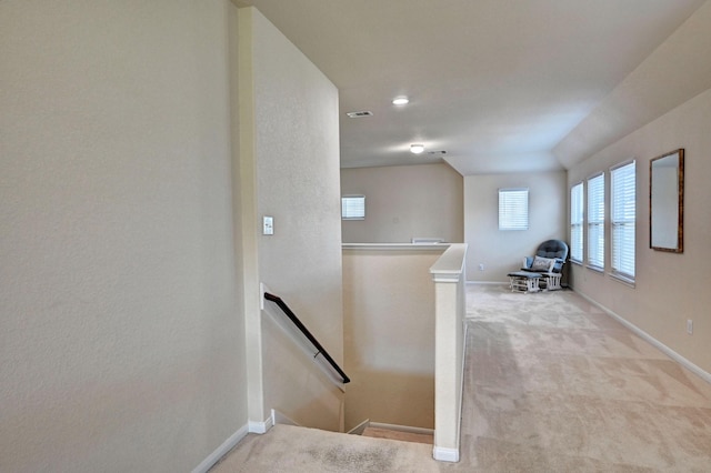 hallway with light carpet