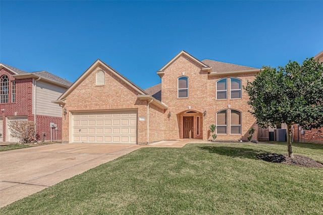 view of property featuring a front lawn and a garage