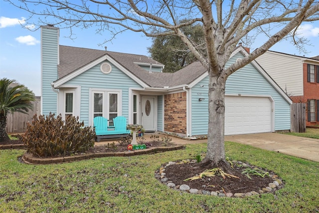 view of front of home with a garage, brick siding, concrete driveway, a chimney, and a front yard