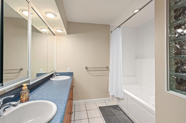 bathroom featuring tile patterned flooring, vanity, and shower / tub combo with curtain