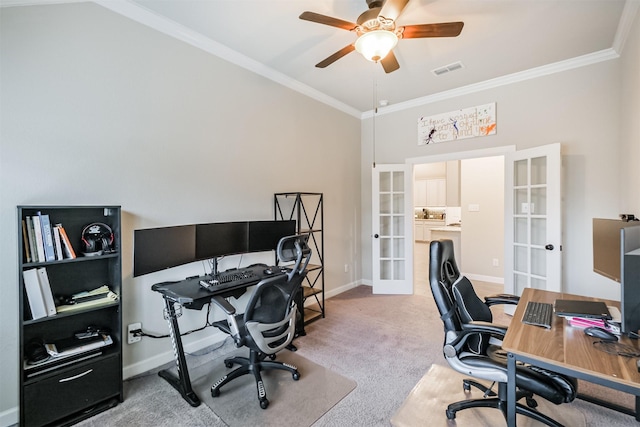 carpeted office with ceiling fan, crown molding, and french doors