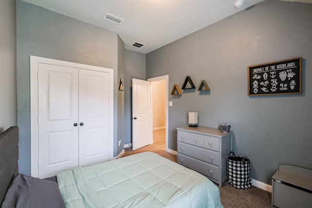 carpeted bedroom featuring a closet