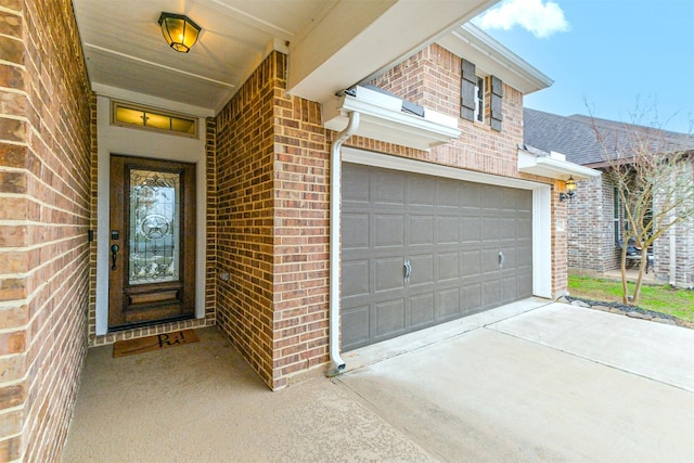 doorway to property featuring a garage