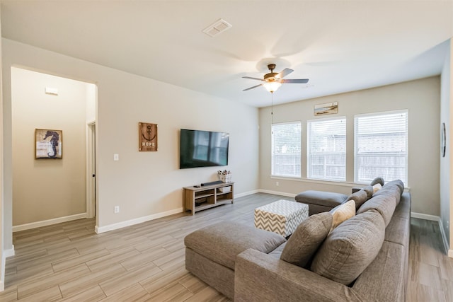 living room with ceiling fan