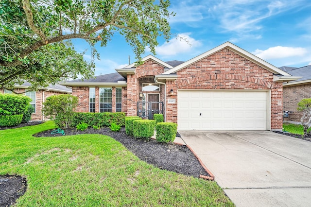 ranch-style house featuring a front lawn and a garage