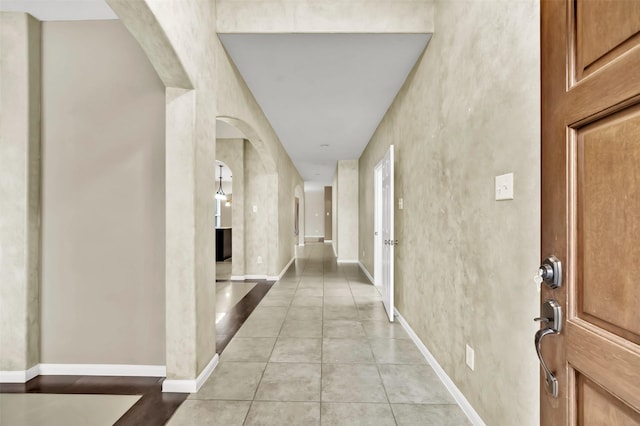 hallway featuring light tile patterned floors