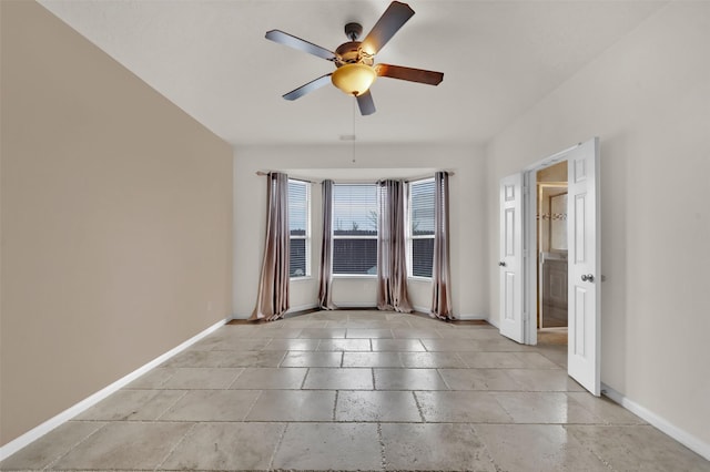 spare room with ceiling fan