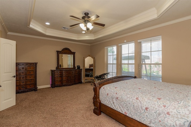 carpeted bedroom featuring ornamental molding, a raised ceiling, and ceiling fan