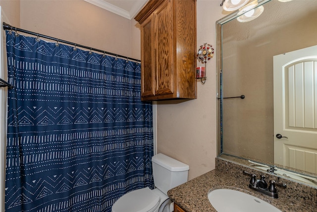 bathroom with ornamental molding, a shower with curtain, vanity, and toilet