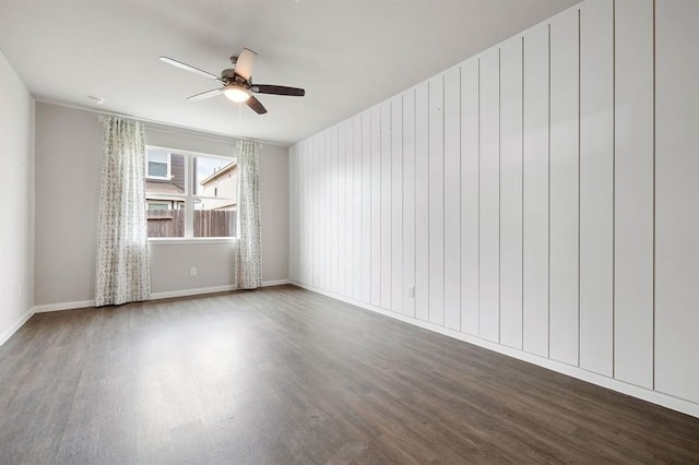 spare room featuring wood-type flooring and ceiling fan