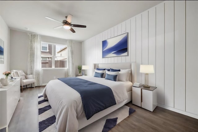 bedroom featuring ceiling fan and dark hardwood / wood-style floors