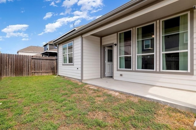 exterior space with a patio area and a yard