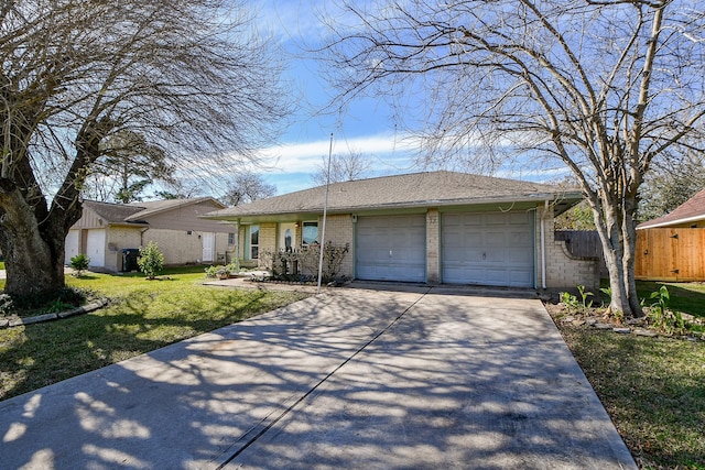 single story home with a front yard and a garage