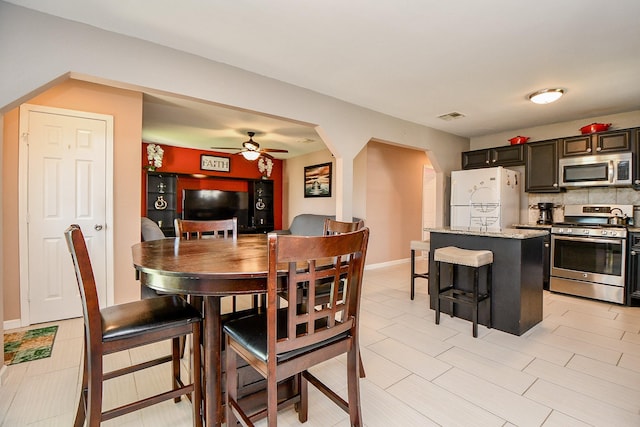 dining room featuring ceiling fan