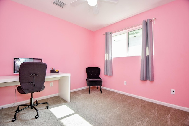 carpeted office space with ceiling fan