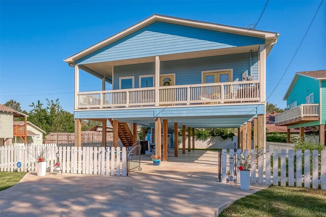 view of front facade with a carport and covered porch