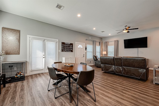 dining area with ceiling fan, hardwood / wood-style floors, and a wealth of natural light