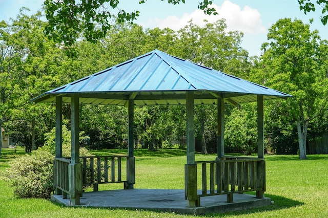 surrounding community featuring a gazebo and a lawn