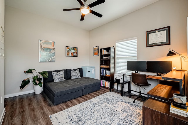 office area with ceiling fan and dark wood-type flooring