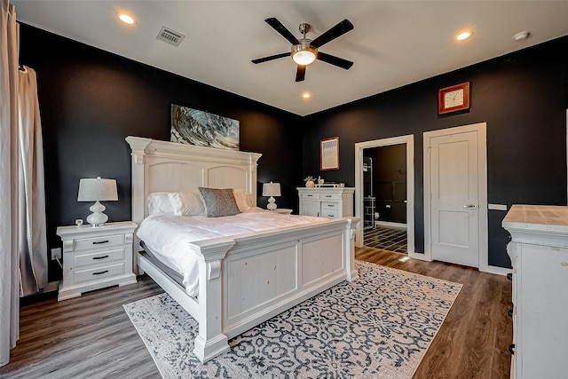 bedroom featuring ceiling fan and dark hardwood / wood-style flooring