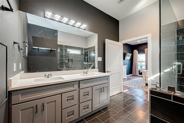 bathroom with vanity, tile patterned flooring, and a shower with shower door