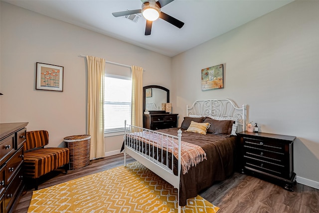 bedroom featuring ceiling fan and dark wood-type flooring