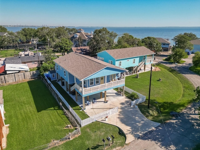 birds eye view of property with a water view