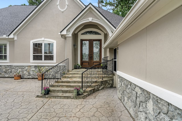 view of exterior entry featuring french doors