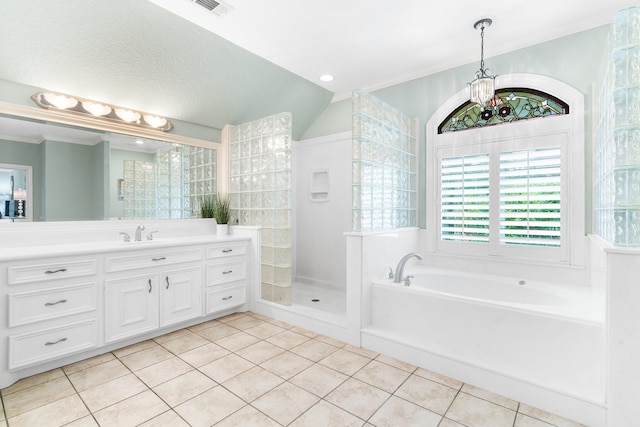 bathroom with an inviting chandelier, tile patterned floors, independent shower and bath, and vanity