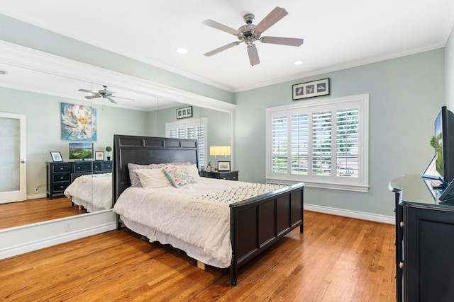 bedroom with crown molding, ceiling fan, and light hardwood / wood-style flooring