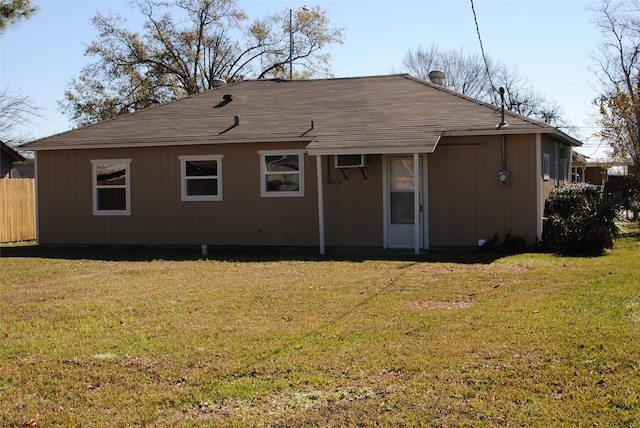 back of house with a yard