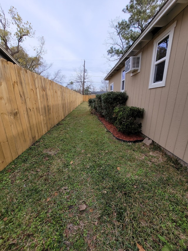 view of yard with a wall mounted AC