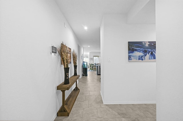 hallway with light tile patterned floors