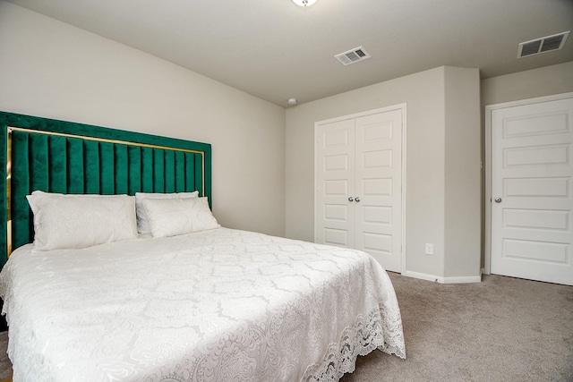 bedroom with a closet and carpet