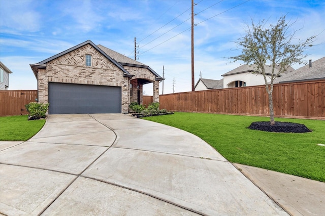 view of front of home featuring a garage and a front yard