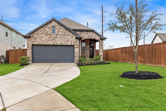 view of front facade featuring a garage and a front yard