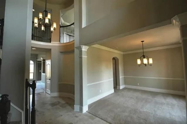 interior space featuring a chandelier and crown molding