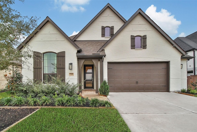 french country home with a garage