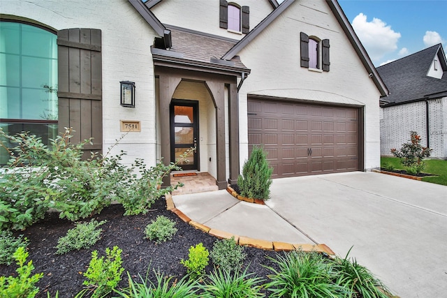 doorway to property featuring a garage