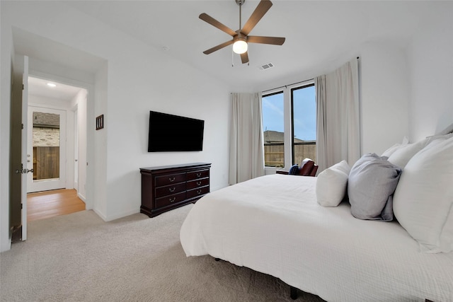 carpeted bedroom with ceiling fan