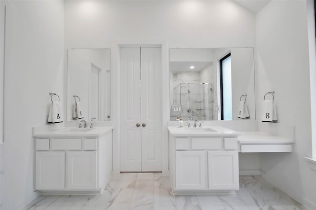 bathroom with a shower with door and vanity