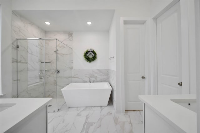 bathroom with vanity, tile walls, and plus walk in shower