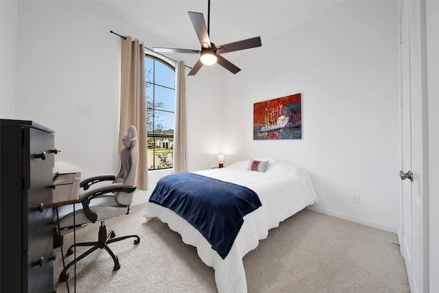 bedroom with light carpet and ceiling fan