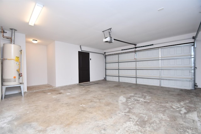 garage featuring water heater and a garage door opener