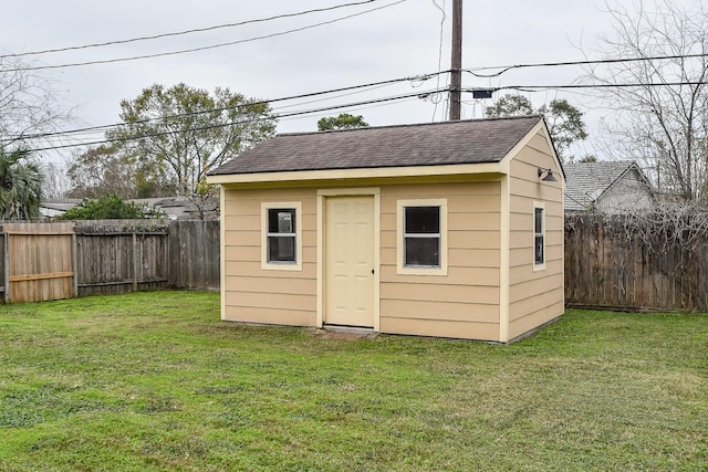 view of outbuilding featuring a yard