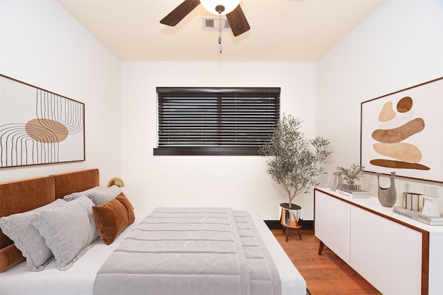 bedroom with ceiling fan and light hardwood / wood-style flooring