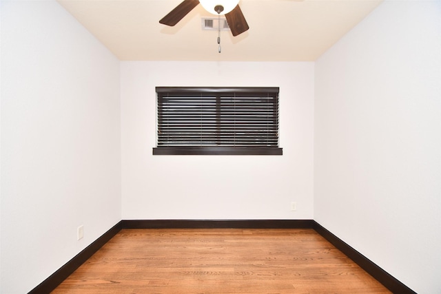 empty room featuring ceiling fan and light hardwood / wood-style flooring