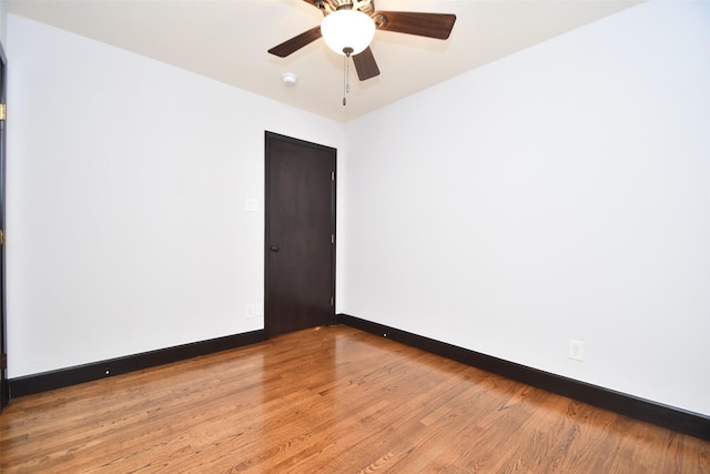 unfurnished room featuring ceiling fan and light hardwood / wood-style floors